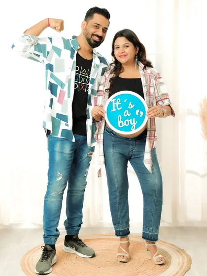 Gender reveal moments make for exciting and memorable photos. This couple joyfully announces "It's a boy" during their maternity session, creating a keepsake of this significant milestone in their pregnancy journey.