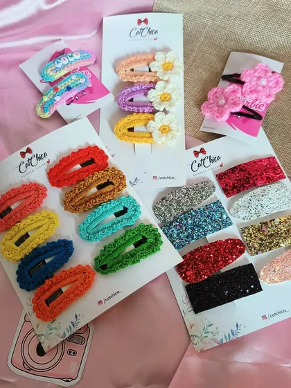 You can never have too many clips! Here’s a glimpse of the variety we offer, from colorful crochet barrettes and fun daisy clips to personalized name clips and sparkly glitter barrettes. There's something for every style.