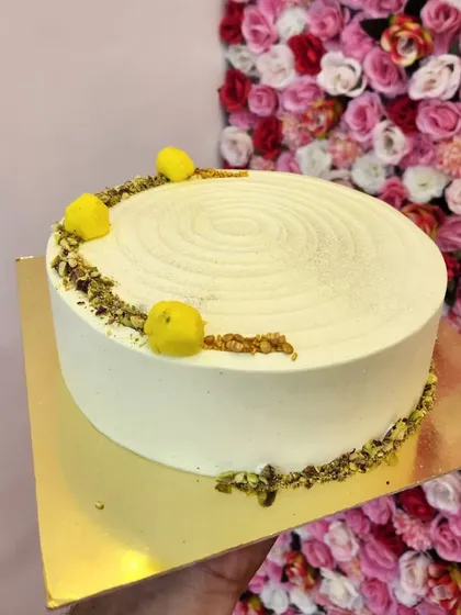 A closer look at my Rasmalai cake. The simple, elegant design with a swirl texture and minimal garnish lets the rich, creamy flavor of rasmalai shine through. It's a modern take on a traditional favorite.