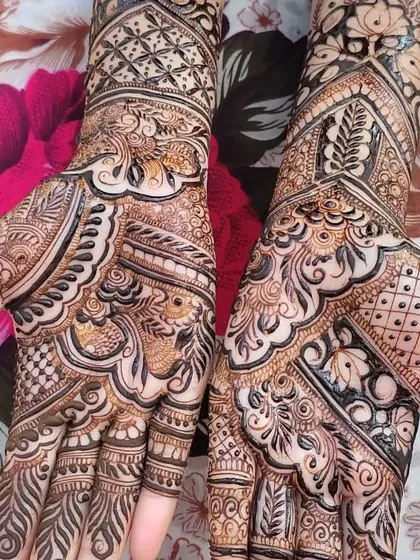 This design features a mix of bold lines and delicate patterns, characteristic of fusion mehendi. The patterns are dense but have a modern, graphic quality.