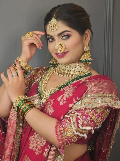 A close-up portrait highlighting the flawless makeup and the beautiful expression of the bride.