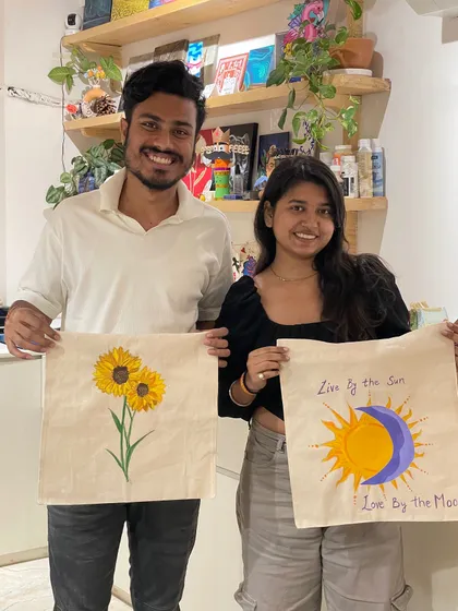 This couple created matching sun and moon themed tote bags, a perfect collaborative art project.