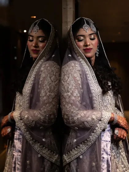 An artistic reflection shot of a bride, creating a beautiful and contemplative portrait.