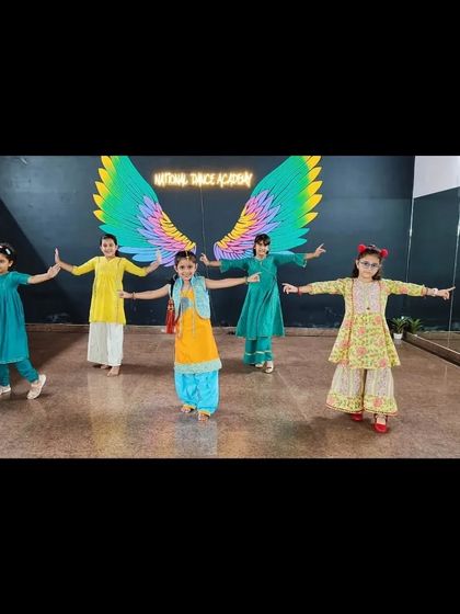 Getting ready for a folk dance performance at our Greenfield studio. Dressed in colorful traditional outfits, these girls are ready to light up the stage.