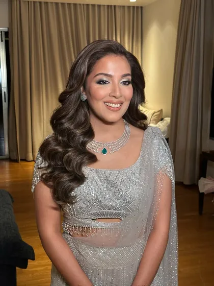 The happy client, her smile as bright as her stunning hairstyle.