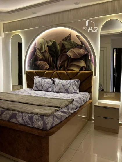 A master bedroom we designed to be a true sanctuary. The arched feature wall with botanical wallpaper, integrated backlit mirrors, and a custom upholstered bed come together to create a cozy, elegant space.