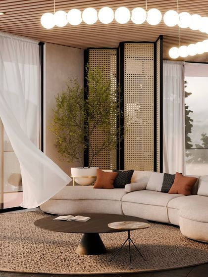The living area of a villa, where a sheer curtain billows in the breeze, highlighting the connection to the outdoors.