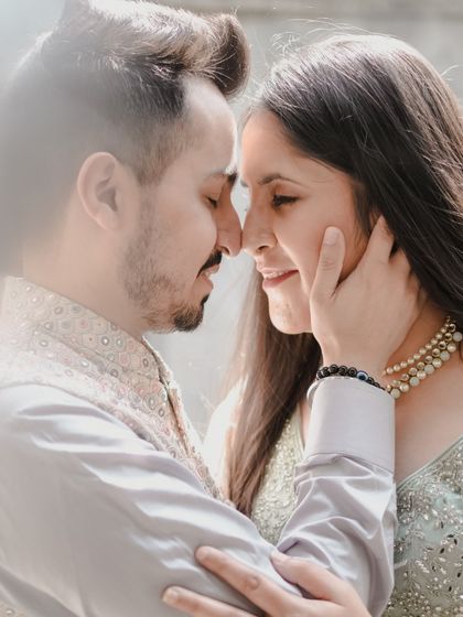 A soft, intimate close-up capturing the gentle connection between a couple, highlighting their traditional attire and the tender emotions of their pre-wedding journey.