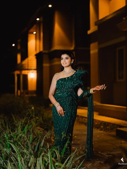 Nidhi was an absolute vision for her reception. We created a bold and stunning look with dramatic smokey eyes and a nude lip to match her gorgeous off-shoulder gown, all set with my signature airbrush finish.