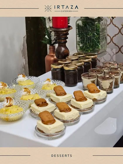A sweet ending is essential. My dessert tables are a feast for the eyes and the palate, featuring a variety of treats like these individual Lotus Biscoff cheesecakes and lemon meringue tarts, ensuring there's something for everyone.