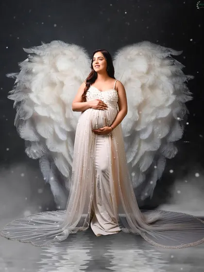 An angelic portrait of Palak Vij, complete with beautiful white wings, creating a dreamy and ethereal feel.
