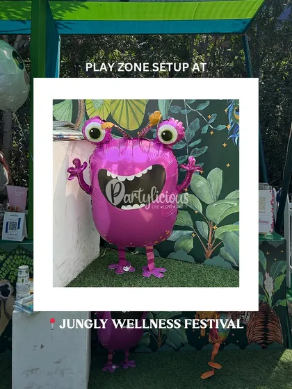 A quirky and fun monster balloon welcomes kids to our play zone setup at the Jungly Wellness Festival.