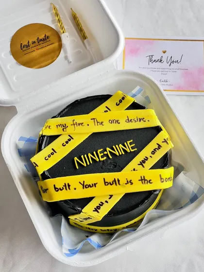 I love bringing your favorite pop culture moments to life. This Brooklyn Nine-Nine themed bento cake features iconic quotes on fondant tape, all piped on a striking black buttercream cake, perfect for a fan's birthday.