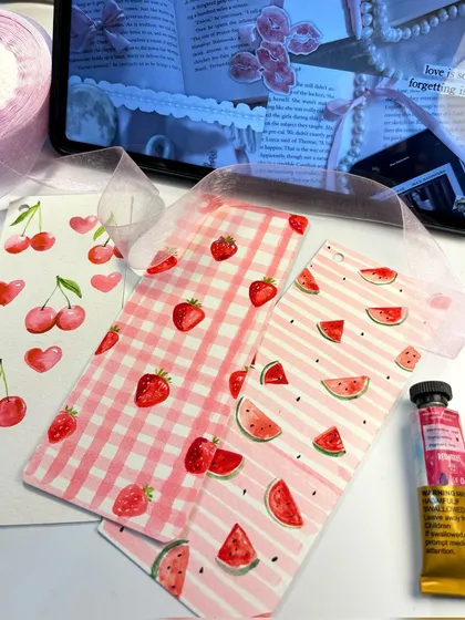 Another shot of my fruit-themed bookmarks, tied with delicate organza ribbons. These are perfect for adding a pop of color to your reading.
