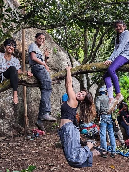 Nikitha and her friends hanging out on a tree at the crag. The social aspect and the friendships formed are a huge part of the BCI experience.