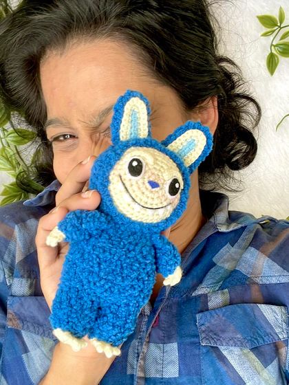 My crochet version of the trendy monster, Labubu! I used a fluffy, textured yarn for his blue suit to make him extra soft and huggable. This one can also be a keychain.