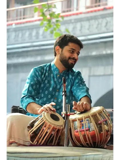 A smiling moment during the performance at Alandi. The joy of playing in such a sacred space is immense.