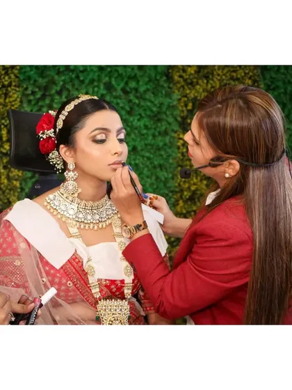 Teaching is my passion. Here I am, live at a seminar, sharing my techniques with aspiring makeup artists. At Glamfort Academy, I focus on hands-on training to ensure every student learns the right way.