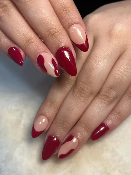 A full view of the abstract red nails. This level of execution demonstrates the effectiveness of hands-on training and personal guidance.