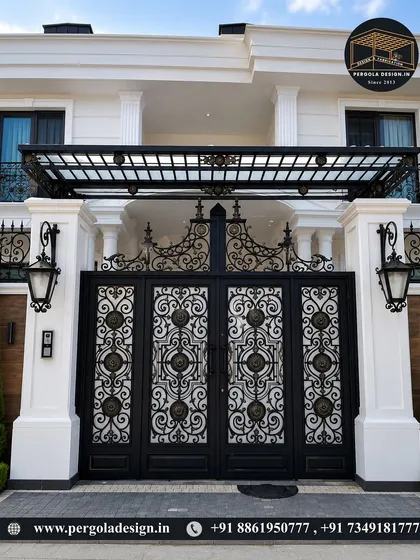 Another example of a grand, decorative gate with a matching overhead canopy. The combination of intricate scrollwork and strong structural lines creates a powerful and sophisticated entrance.