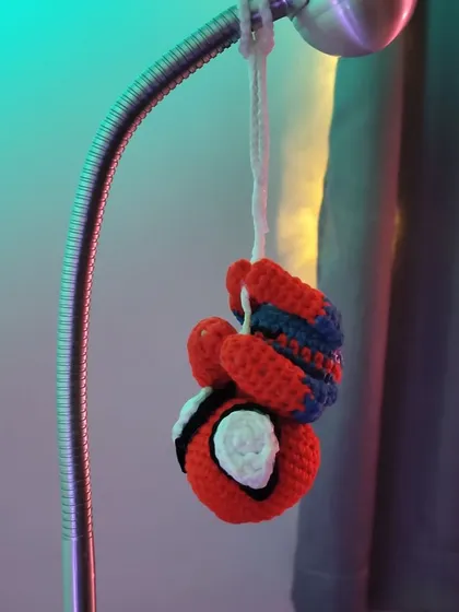 Your friendly neighborhood Spider-Man, hanging around. This little crochet Spidey is perfect as a car charm or a small decorative piece for a fan's room.