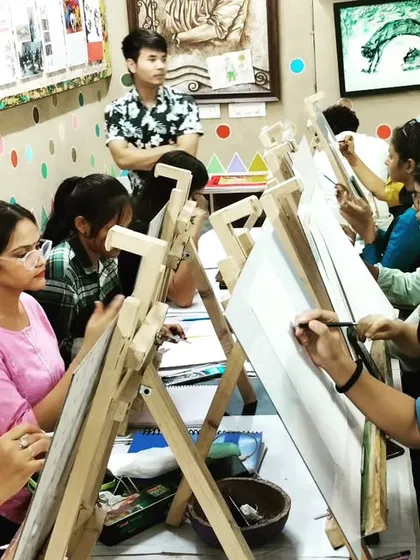 A candid shot of our drawing class in session, with students of various levels learning and creating together at their easels.