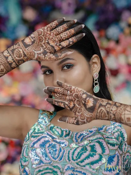 This mermaid-themed mehndi shows how we can adapt traditional art to fit your unique wedding theme. The design incorporates aquatic elements while maintaining the elegance of bridal henna.