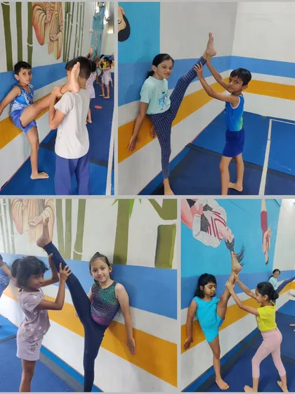 Our students, both boys and girls, work together on their flexibility. Here they are practicing partner-assisted leg holds to improve their active flexibility.