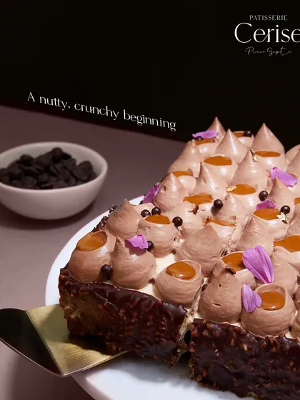 A nutty, crunchy beginning. This shot highlights the rich coating and the carefully piped hazelnut mascarpone mousse, each dotted with a drop of caramel.