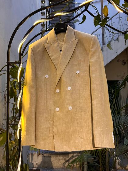 This double-breasted linen blazer is a versatile summer staple. Unlined and lightweight, it can be dressed up or down while keeping you cool and stylish.