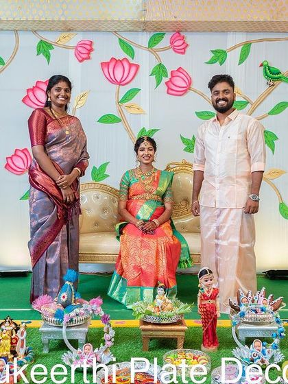 Another lovely photo with the family. The floral backdrop and my colorful platters created a perfect setting for their Valaikaapu celebration photos.