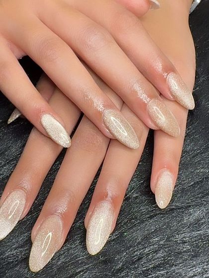 A full view of the beautiful champagne cat eye nails.