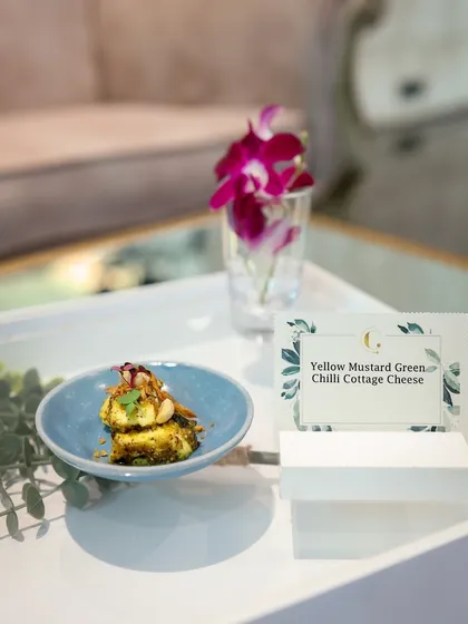 Yellow Mustard Green Chilli Cottage Cheese. This dish features soft paneer marinated in a pungent mustard and chili paste, offering a bold and flavourful experience.
