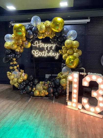 A clear shot of the impressive balloon ring and light-up numbers for the 13th birthday party.