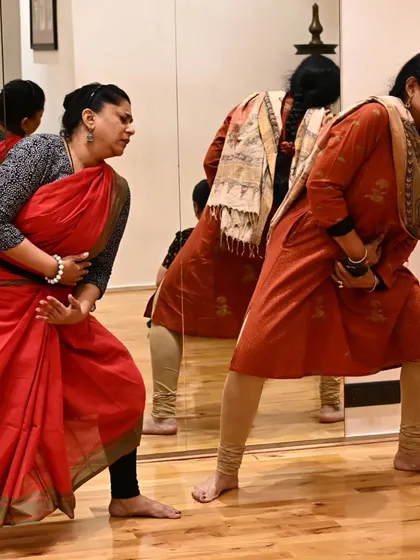 Guiding dancers through a movement sequence in the studio. The process of creation involves a lot of experimentation and physical exploration.