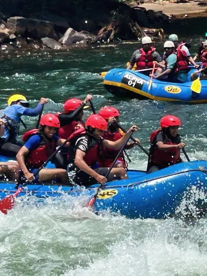 Two rafts navigate the rapids side-by-side during a summer camp course at Dandeli. It’s a great way for kids to build confidence and teamwork skills.