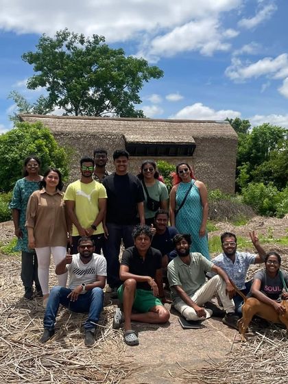 A group photo of the team at one of our earliest experiments in natural building. It's a reminder of how far we've come.