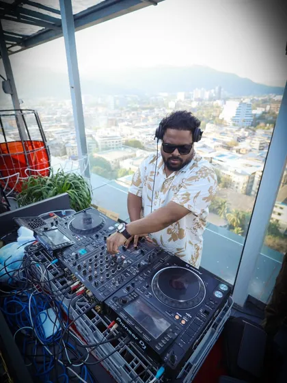 A clear shot of my professional Pioneer DJ setup against the backdrop of the city. I bring my own high-quality equipment to every event to guarantee the best sound.