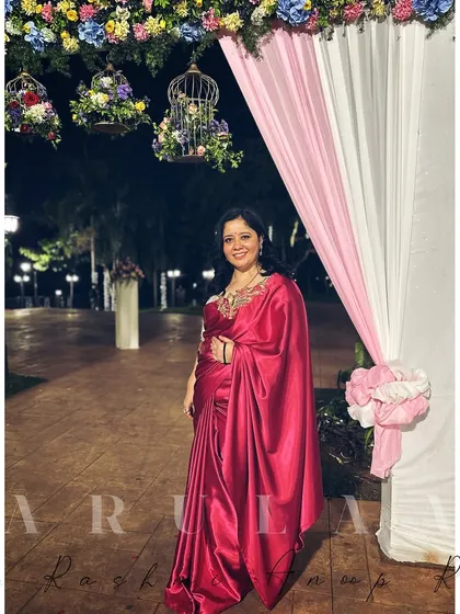 The full look of my pink satin saree and custom blouse at an evening event. I love the way the satin drapes and catches the light.