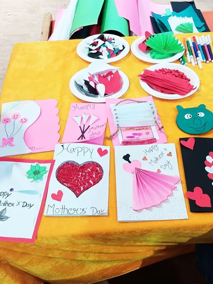 A colorful display of handmade Mother's Day cards created by children during our workshop.