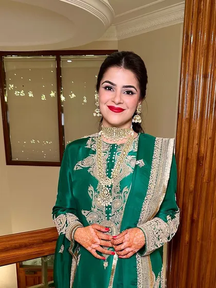 Another shot of the classic red lip. This look is a perfect example of how a bold lip can be the centerpiece of an elegant and traditional Mehendi look.