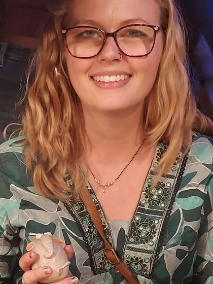 A customer from abroad holding one of my little elephant figurines. It's humbling to know my work travels to homes all around the world.