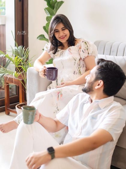 A relaxed and natural shot of a couple enjoying a quiet moment during their at-home maternity session.