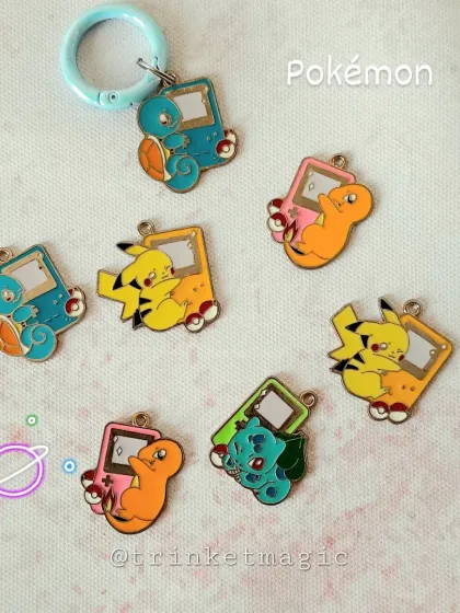 Gotta catch 'em all! This collection of Pokémon charms features Pikachu, Charmander, and Bulbasaur with retro Game Boy designs.