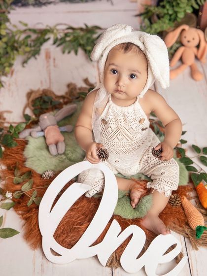 Marking 'One' with my little bunny. This milestone portrait combines a whimsical theme with a classic celebration, resulting in a unique and memorable photo.