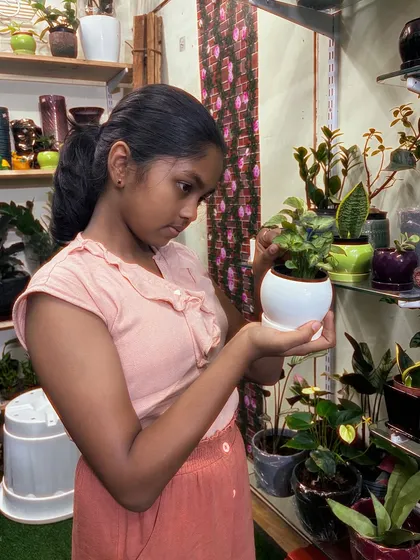 The look of concentration while picking the perfect plant. It's a big decision, and I'm always there to help with suggestions and care tips.