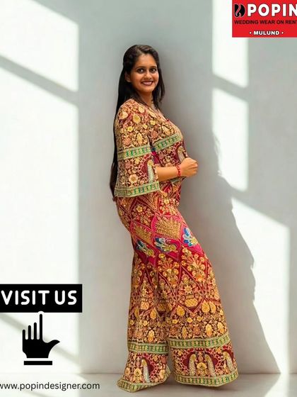 This red embroidered plazo set is vibrant and full of grace. The intricate embroidery on the pants and top makes it a luxurious choice for a festive occasion.