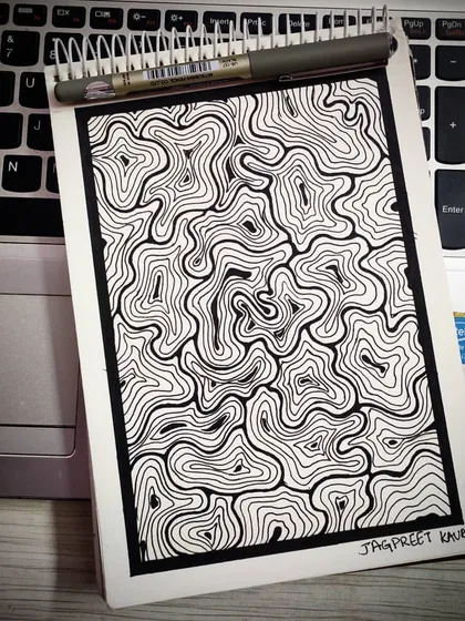 A hand-drawn abstract pattern of chaotic, swirling lines contained within a neat border. This piece is about finding order within chaos and the beauty that can emerge from a wandering mind and a steady hand.