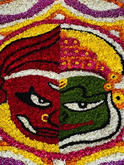 A closer view of the intricate floral work in our Kathakali themed Pookkalam. We use a variety of flowers to achieve rich colors and textures in every design we create.
