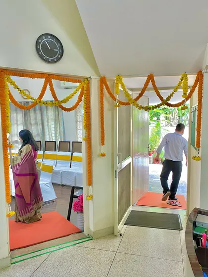 Here you can see my floral door hangings in an active office setting. These marigold torans are set up to welcome employees and guests into different sections of the office, adding a touch of tradition to the corporate environment.